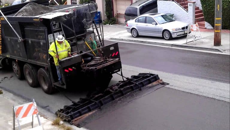 Application of slurry seal on a road