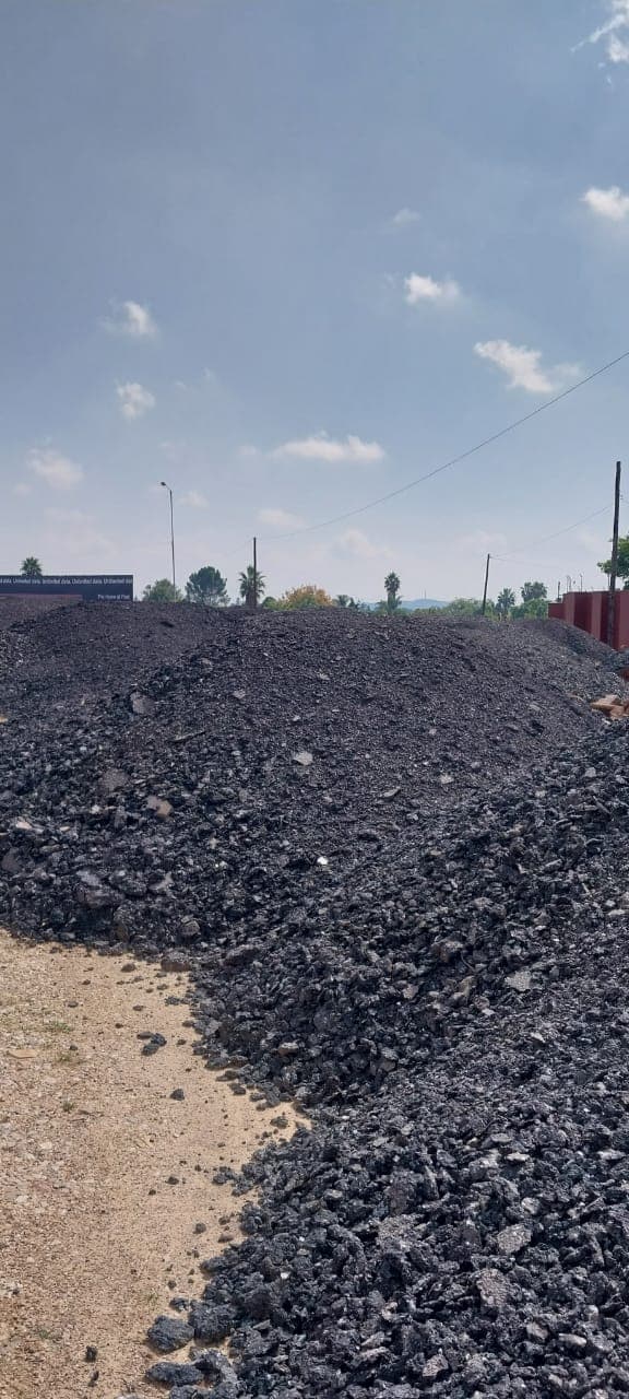 Asphalt milling machine removing old pavement layer